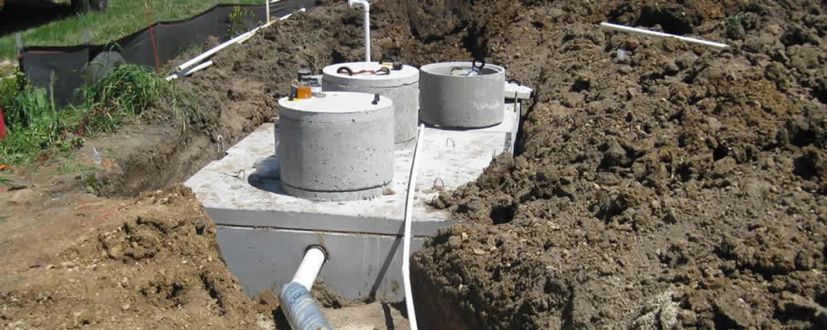 Septic system repair and installation site with tank access ports in Albany, NY